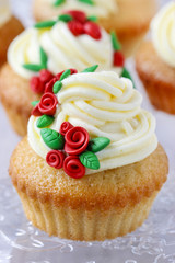 Wedding reception cupcakes decorated with sugarcraft red roses