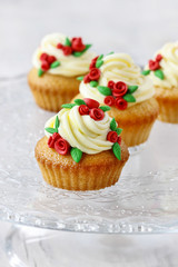 Wedding reception cupcakes decorated with sugarcraft red roses