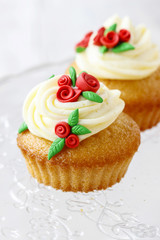 Wedding reception cupcakes decorated with sugarcraft red roses