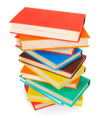 Multi-coloured books. On white background.