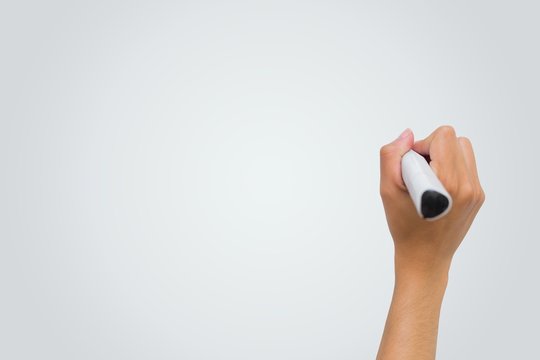 Female hand writing with marker