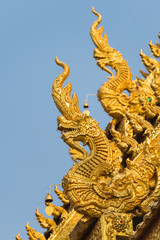 Fototapeta na wymiar Sculpture dragon at Wat Sri Pan Ton