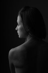 Portrait of beautiful woman sitting with a bare back
