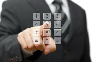 businessman is dialing on virtual telephone keypad