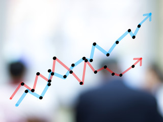 growth bar chart with blurred business people background