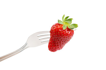 Fresh strawberry on a fork on white background.