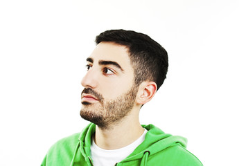 Fototapeta premium Young man looking up into the corner with lots of copy space