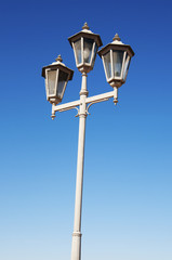 Fototapeta na wymiar Lamp Post Street Road over blue sky