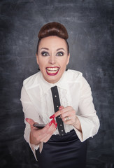 Fototapeta premium Angry business woman with mobile phone