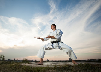 Man practicing martial arts outdoors