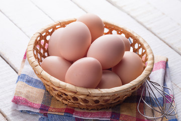 Chicken eggs on wooden background