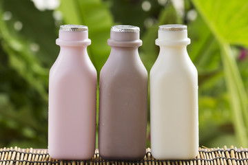 Strawberry, chocolate and fresh milk bottles