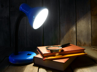 The fixture, books and a magnifier.