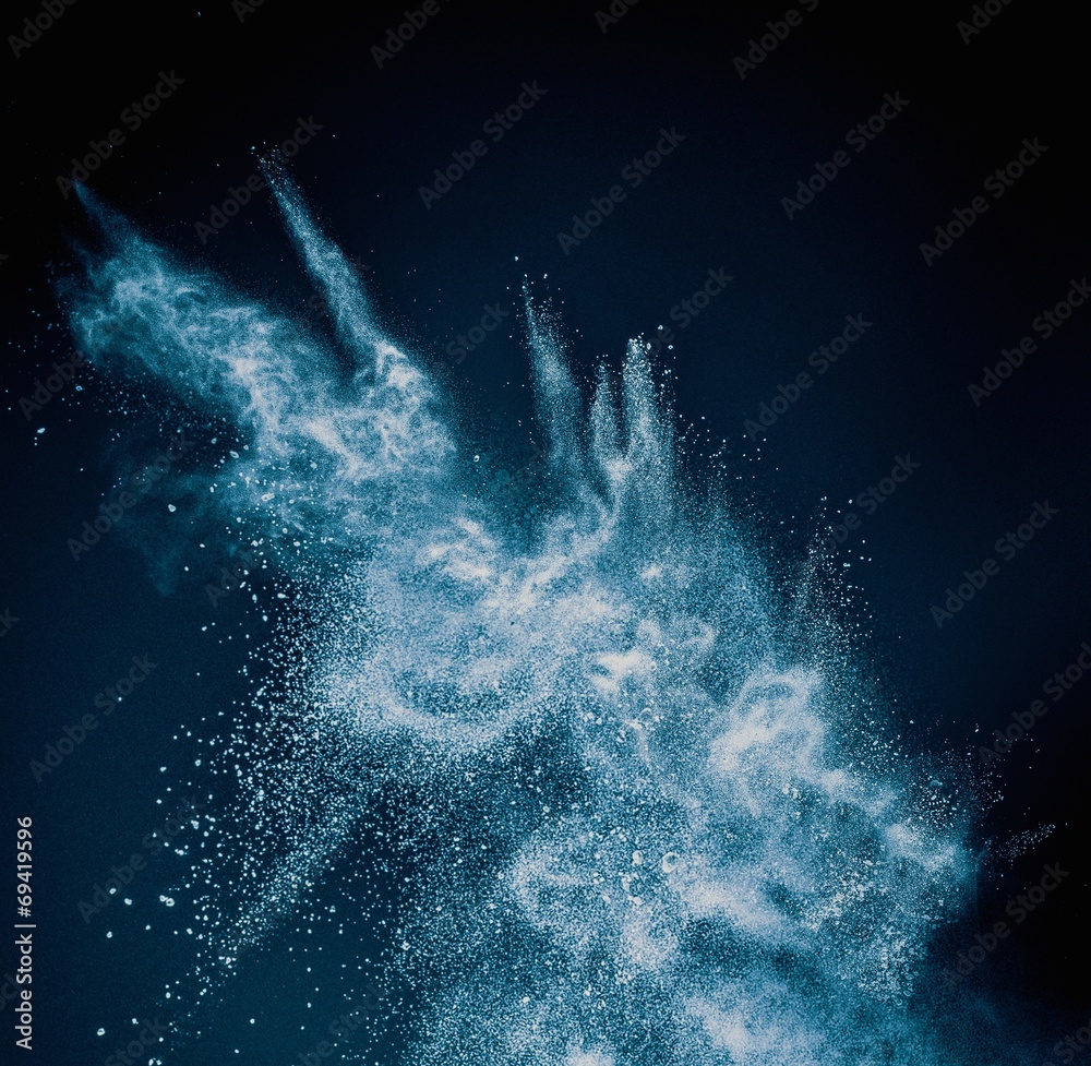 Canvas Prints blue powder exploding isolated on black