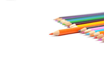 Colored pencils on white background