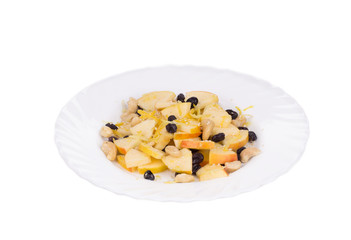 Fitness salad with black raisins and cashew.