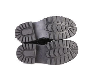 Sole side of black leather boots.