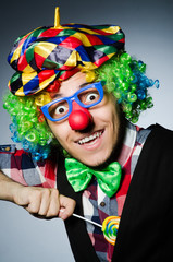 Funny clown with sweet lollipop