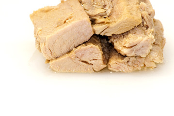 Group of pieces of tuna in olive oil