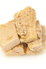 Group of pieces of tuna in olive oil