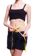 Young girl with centimeter in dieting concept