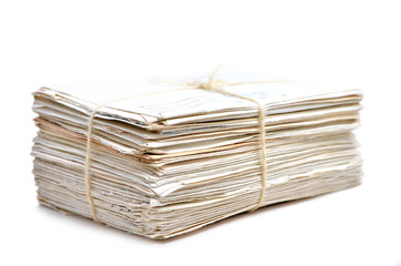 Stack of letters on white background