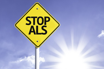Stop ALS road sign with sun background