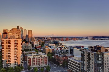 Fototapeta premium Scenic view of mountain Rainer during sunset. Downtown and port