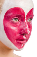 Woman with heart face painting isolated on white