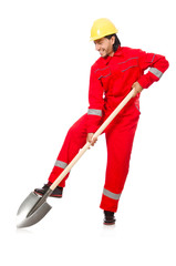 Man in red coveralls with spade