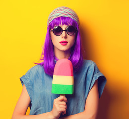 Beautiful girl with violet hair in sunglasses and ice-cream on y