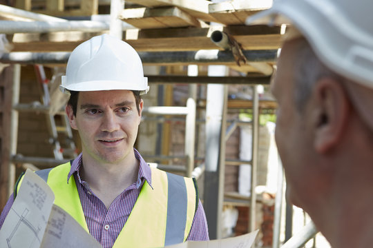 Architect Discussing Plans With Builder