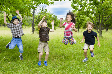 Kids Jumping in a orchard
