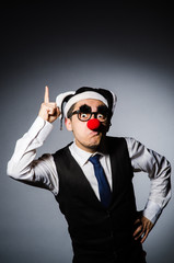 Fototapeta premium Clown businessman in funny concept