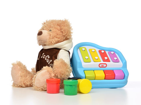 Child baby toys collage with colorfull paints, teddy bear xyloph