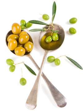 Olives, olive oil and twig of olive tree