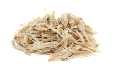Dried anchovies over white background