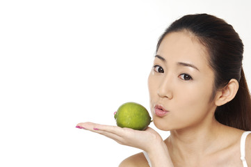 beauty skin care woman smiling close-up. and holding lemon,