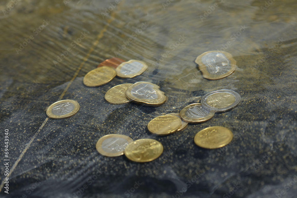 Wall mural coins under water