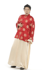 Oriental young man with tradition clothing posing