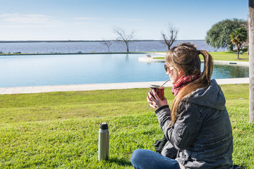 Argentine Young Woman, Relaxing and Drinking Mate.