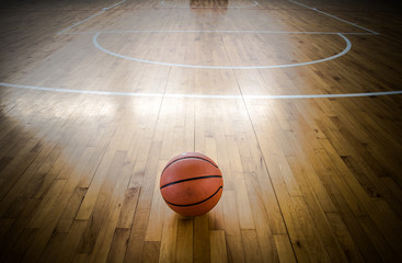 Basketball ball over floor in the gym