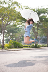 Jumping with umbrella