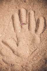 Ring hand print sand