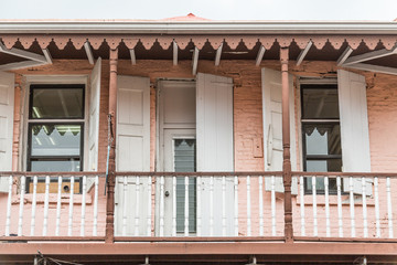 Old Pink and White Building with Doors and Windows