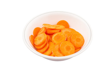 Chopped carrot in a bowl over white background