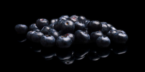 Assortment of fresh blueberries isolated black