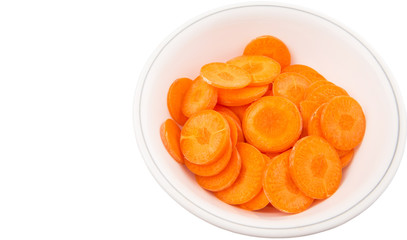 Chopped carrot in a bowl over white background