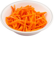 Chopped carrot in a bowl over white background