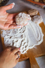 Woman cooking meatballs